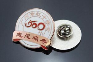 Metal badges are customized in custom design